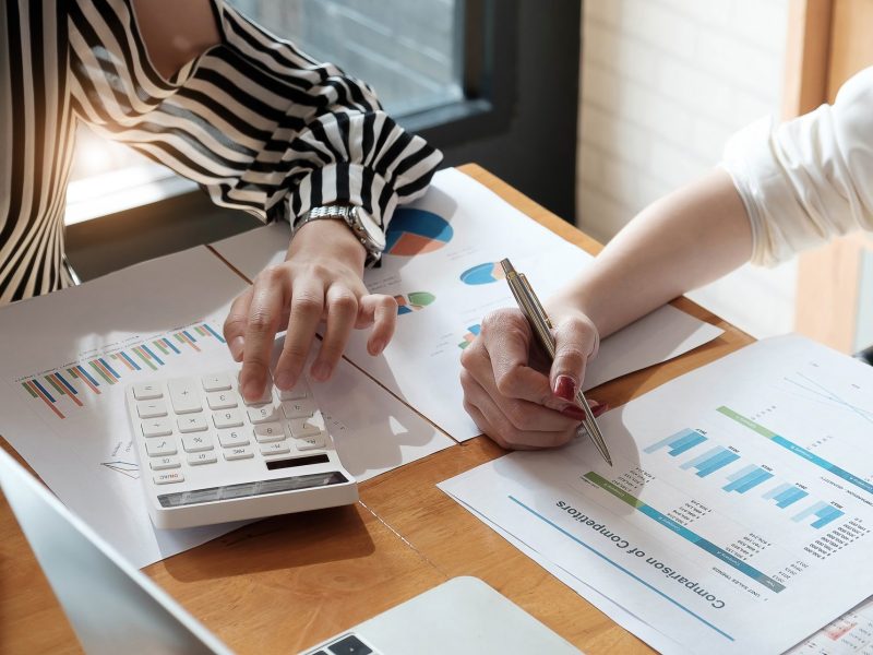 financial advisory services. Group of business advisor showing plan of investment to clients in the consultancy office.