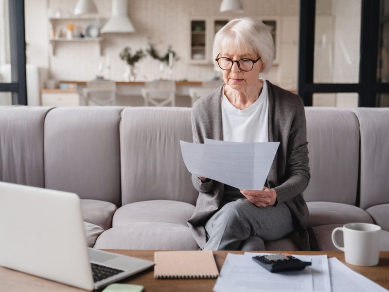 grandmother-checking-pension-documents-loan-e-ba-2022-02-04-00-38-12-utc(1)