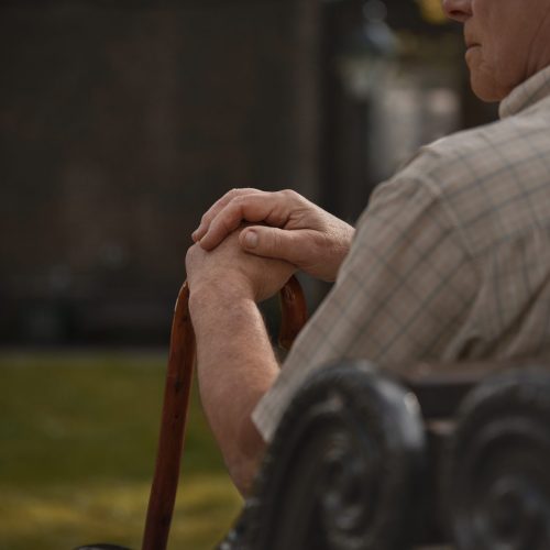 side-view-old-man-sitting-bench